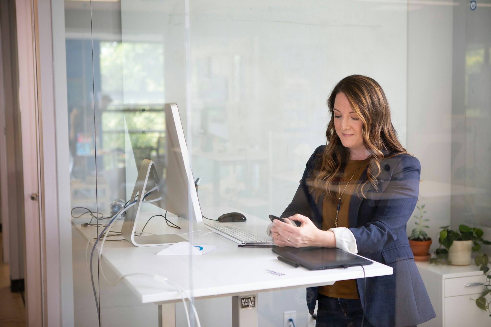 healthcare office administrator at a standup desk